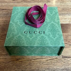 Gucci box with ribbon